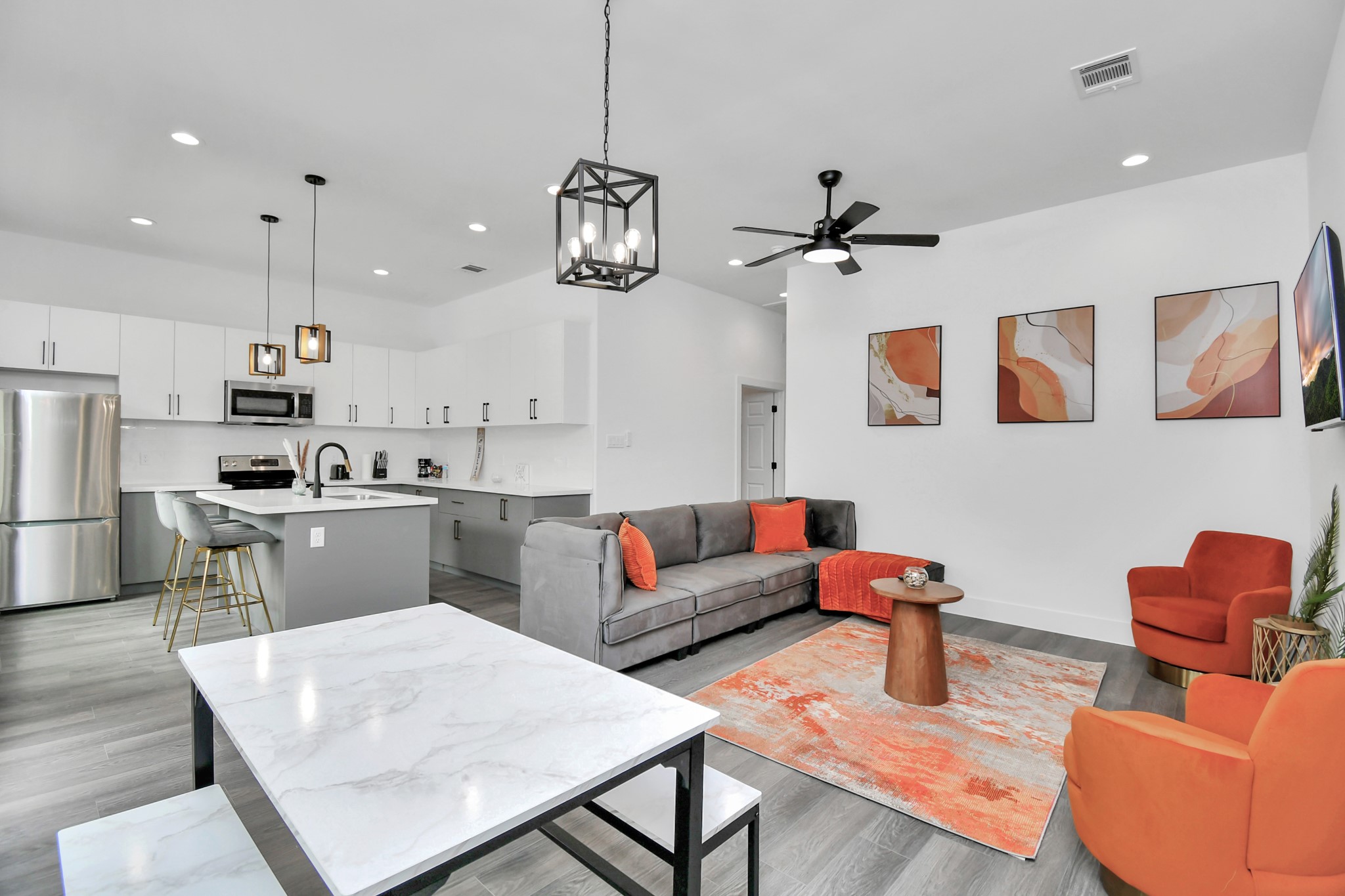 4909 Higgins Street, Unit A Houston, TX 77033 - Photo 7 of 32 a living room with stainless steel appliances kitchen island granite countertop furniture and a dining table