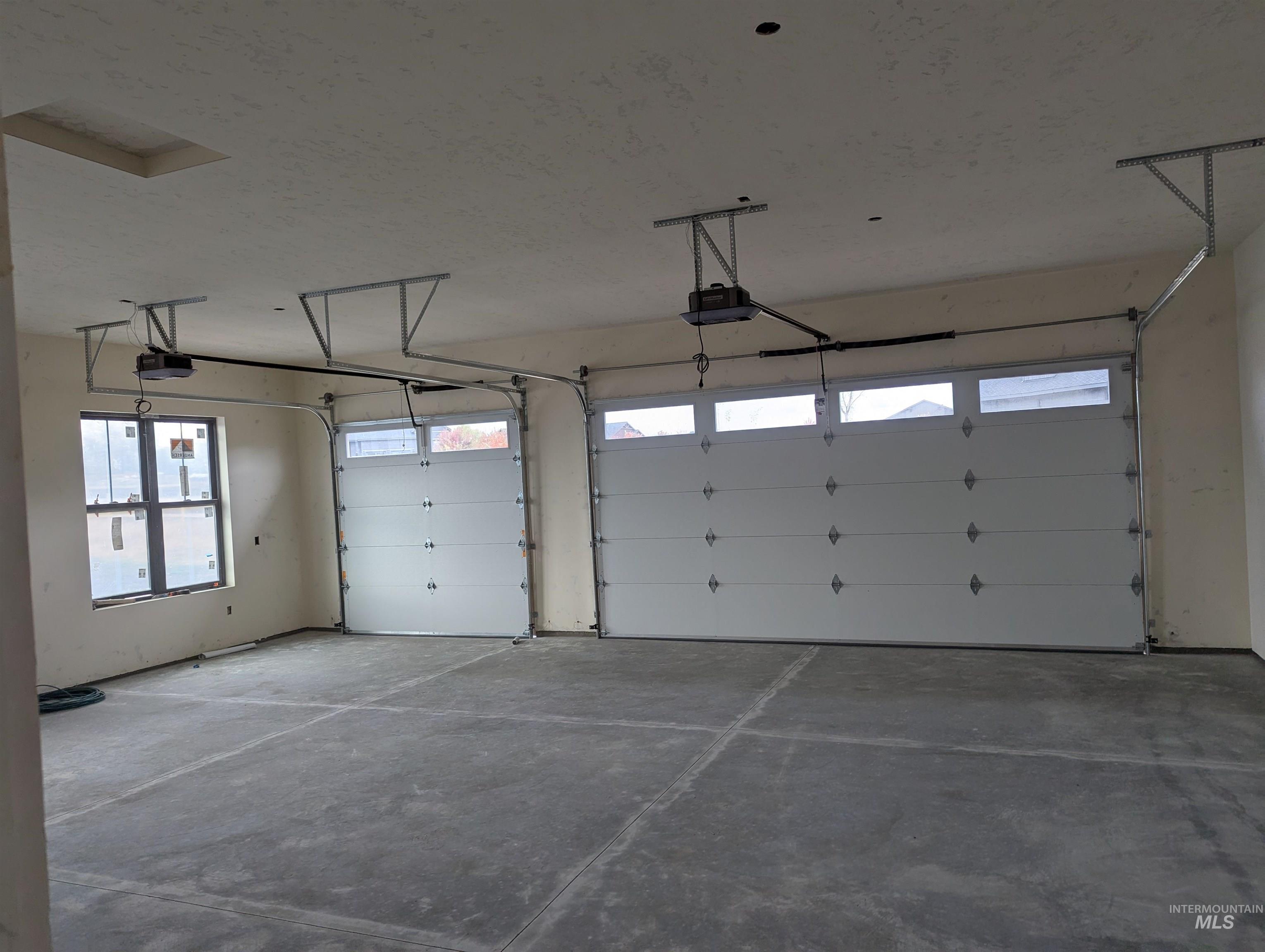 13910 Sky View Court, Unit 8 McCall, ID 83638 - Photo 35 of 40 Garage with a garage door opener