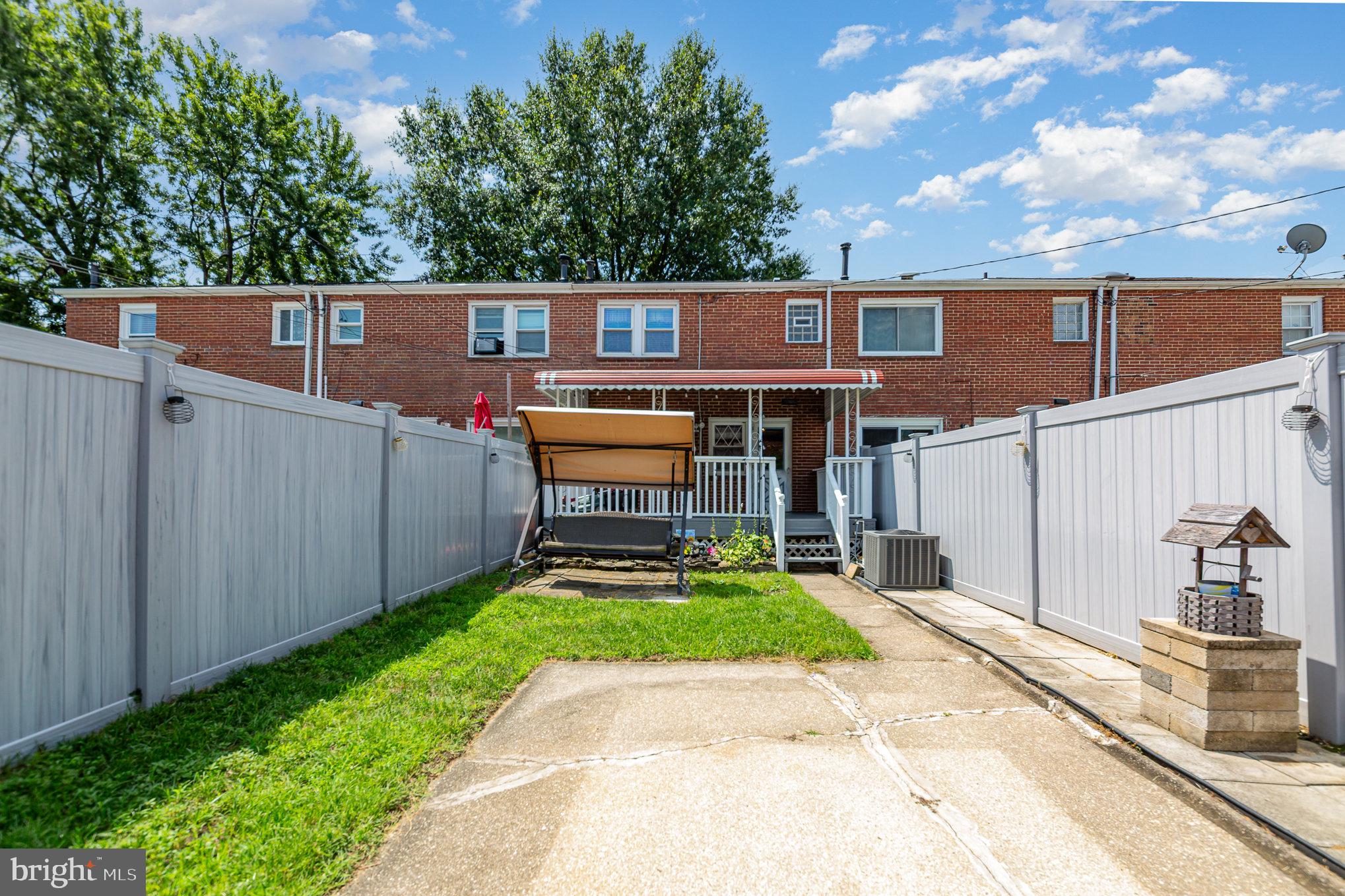 8226 North Boundary Road Baltimore, MD 21222 - Photo 32 of 37 a backyard of a house with table and chairs