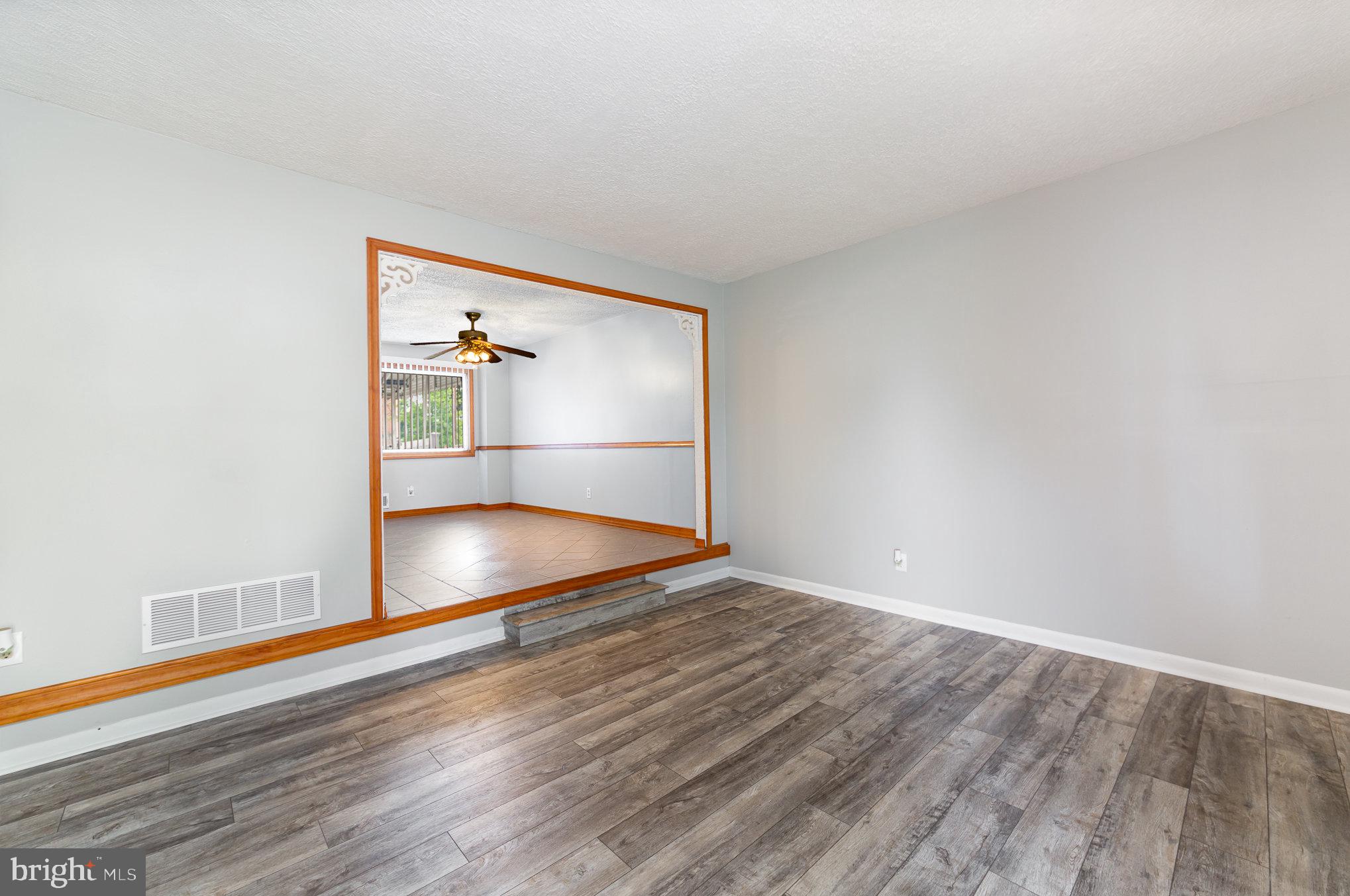 8226 North Boundary Road Baltimore, MD 21222 - Photo 8 of 37 a view of empty room with wooden floor