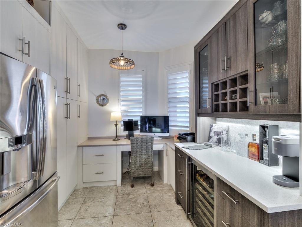 170 Lenell Road, Unit 402 Fort Myers Beach, FL 33931 - Photo 23 of 41 Custom cupboards, wine cooler & work desk