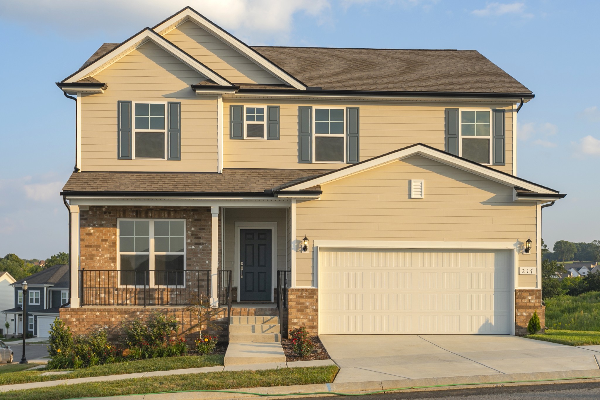 a front view of a house with garden