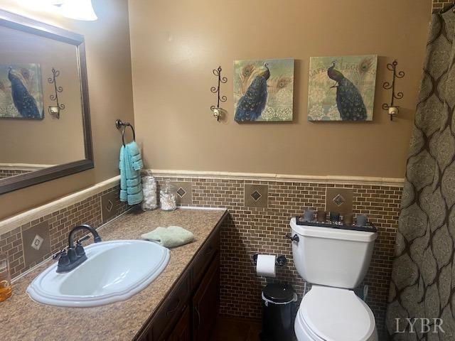1934 New Chapel Road Rustburg, VA 24588 - Photo 21 of 80 a bathroom with a toilet sink and mirror