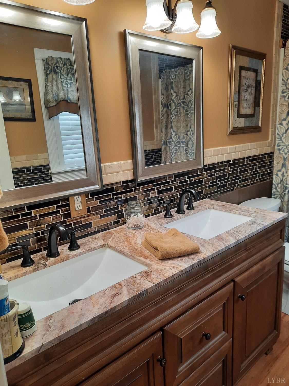 1934 New Chapel Road Rustburg, VA 24588 - Photo 69 of 80 a bathroom with a sink and a mirror