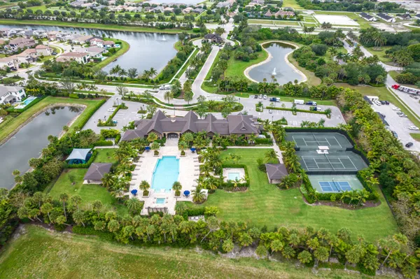 an aerial view of residential houses with outdoor space and street view