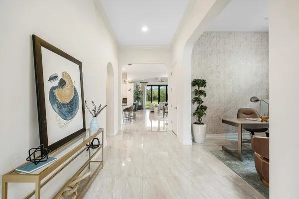 a kitchen with stainless steel appliances kitchen island granite countertop a table and chairs in it