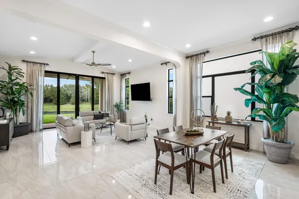 a dining room with furniture and entryway