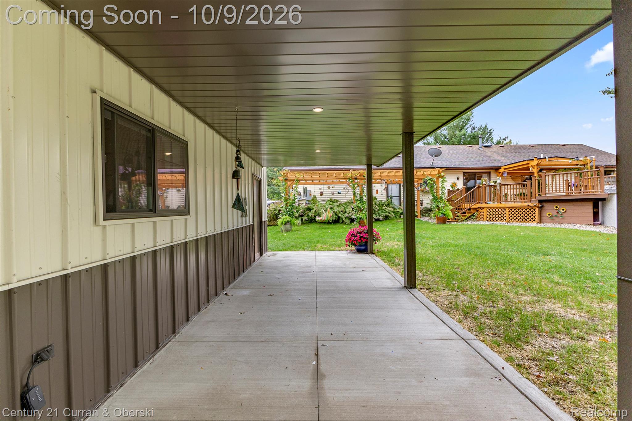 43040 Willis Road Belleville, MI 48111 - Photo 52 of 65 Covered concrete walkway with exterior window and exterior door