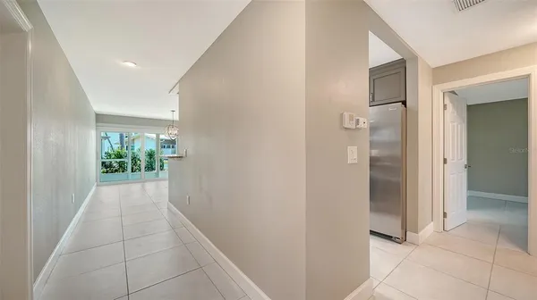 a dining room with furniture and garden view