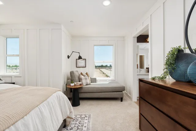 a bedroom with a bed and a couch