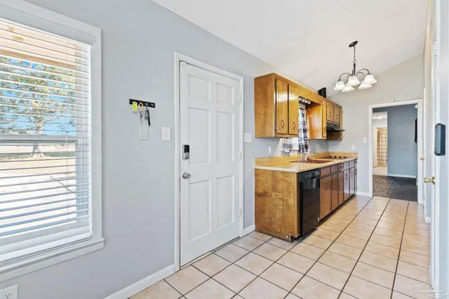 a kitchen with stainless steel appliances a sink and a stove top oven