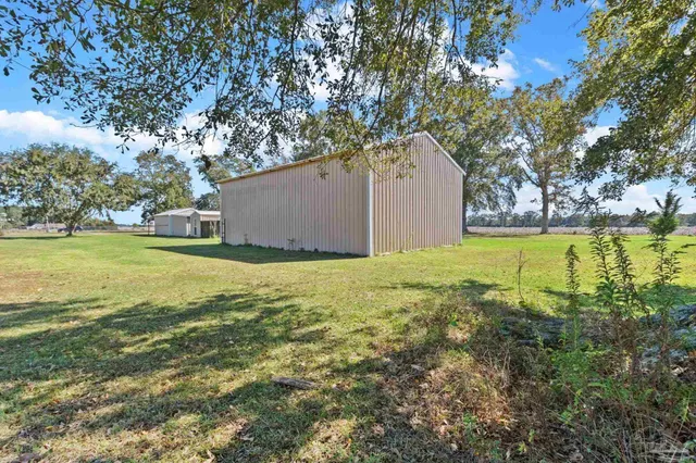 a view of a swimming pool with an outdoor space and seating area