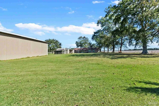a view of a swimming pool with an outdoor space and seating area