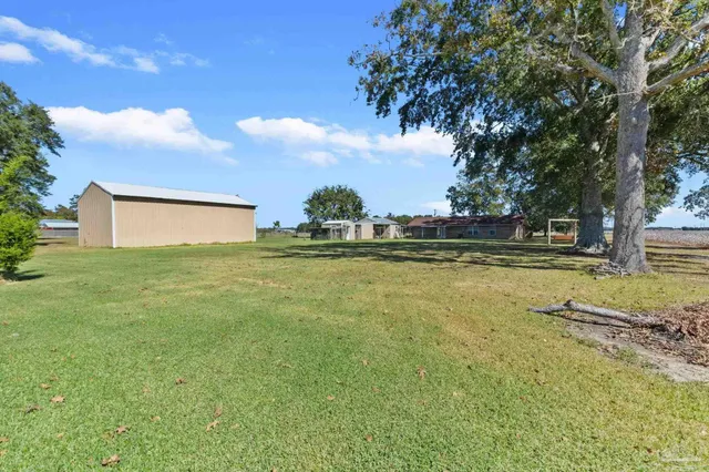 a front view of house with yard and green space