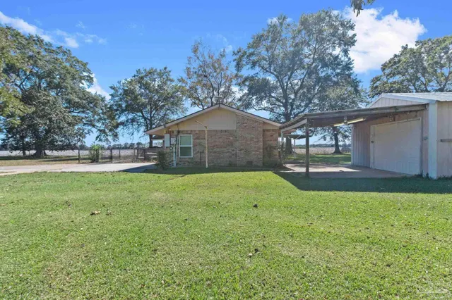 a backyard of a house with seating space