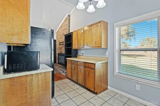 a kitchen with stainless steel appliances a stove a sink and a microwave
