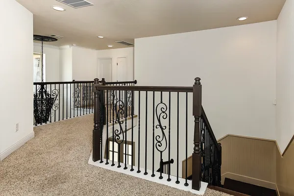 a view of a hallway with windows