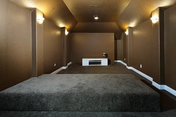a bedroom with a bed and a lamp