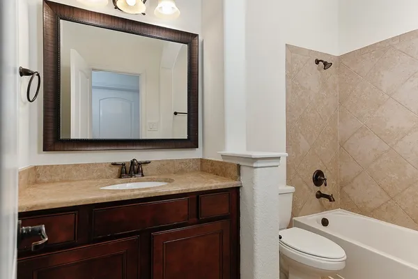 a bathroom with a toilet a sink and a bathtub