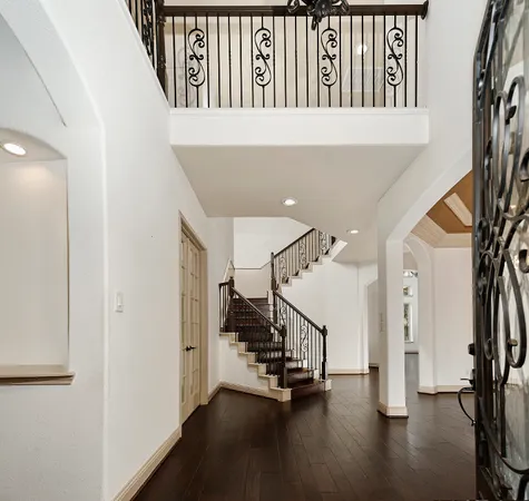 a view of an entryway with wooden floor
