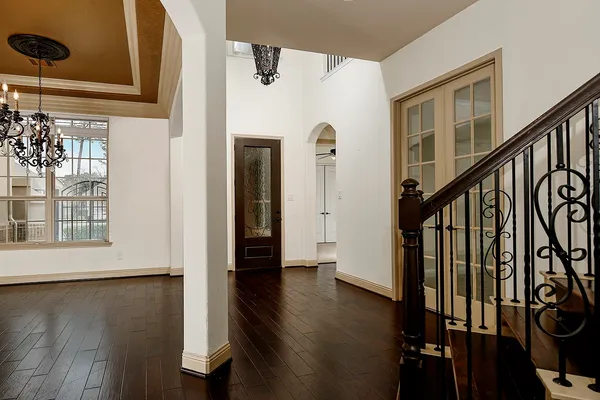 a view of an entryway with wooden floor