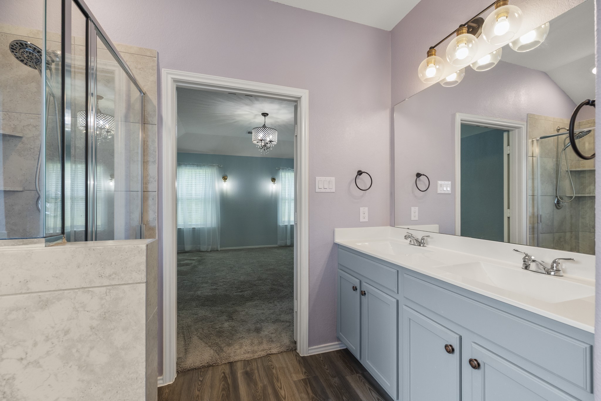 12340 Delta Timber Road Conroe, TX 77304 - Photo 26 of 41 Primary bathroom with 2 sinks, shower and soaker tub.