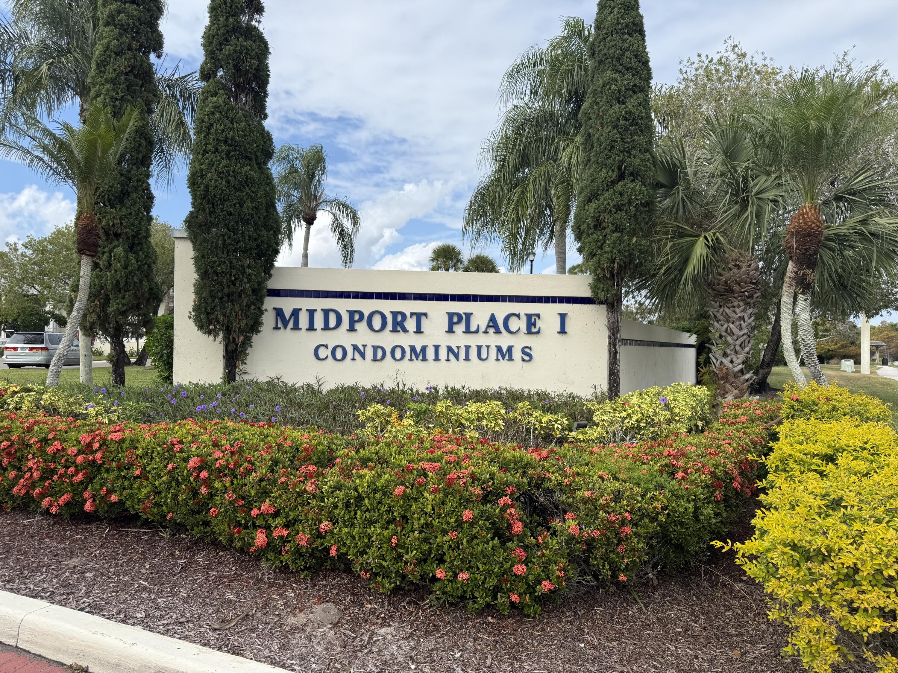 1520 Southeast Royal Green Circle, Unit K 205 Port St. Lucie, FL 34952 - Photo 18 of 18 a sign on the side of the road