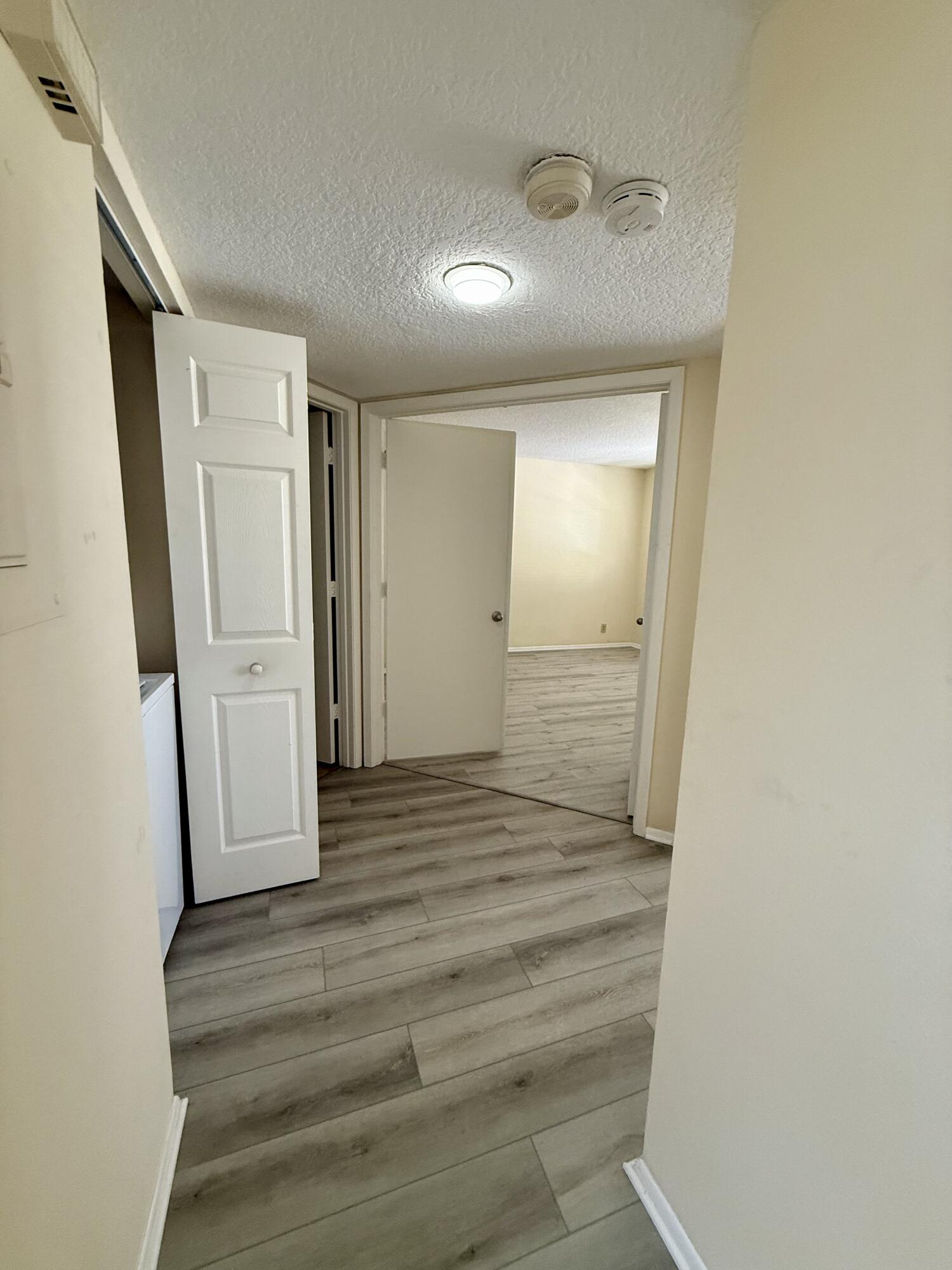 1520 Southeast Royal Green Circle, Unit K 205 Port St. Lucie, FL 34952 - Photo 5 of 18 a view of wooden floor