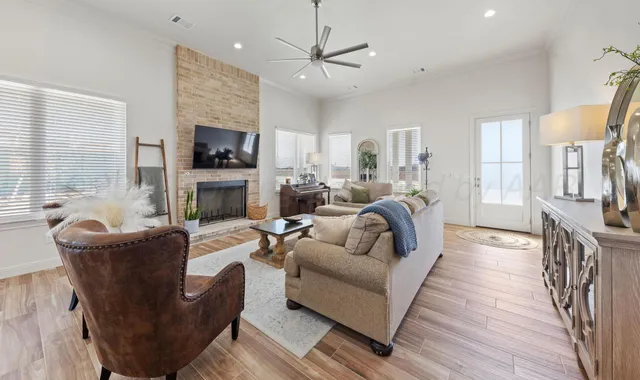 a living room with furniture fireplace and flat screen tv