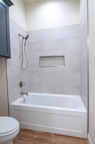 a bathroom with a bath tub and a shower