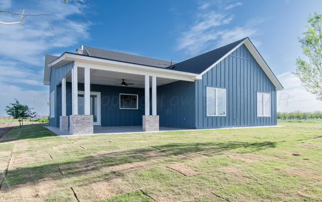 a view of house with yard