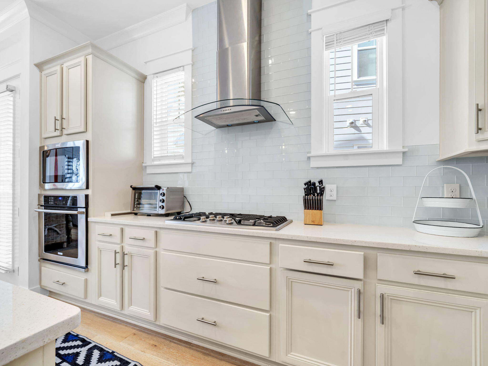 282 Milestone Dr Inlet Beach, Unit B Inlet Beach, FL 32461 - Photo 12 of 42 a kitchen with stainless steel appliances granite countertop white cabinets a window and a sink