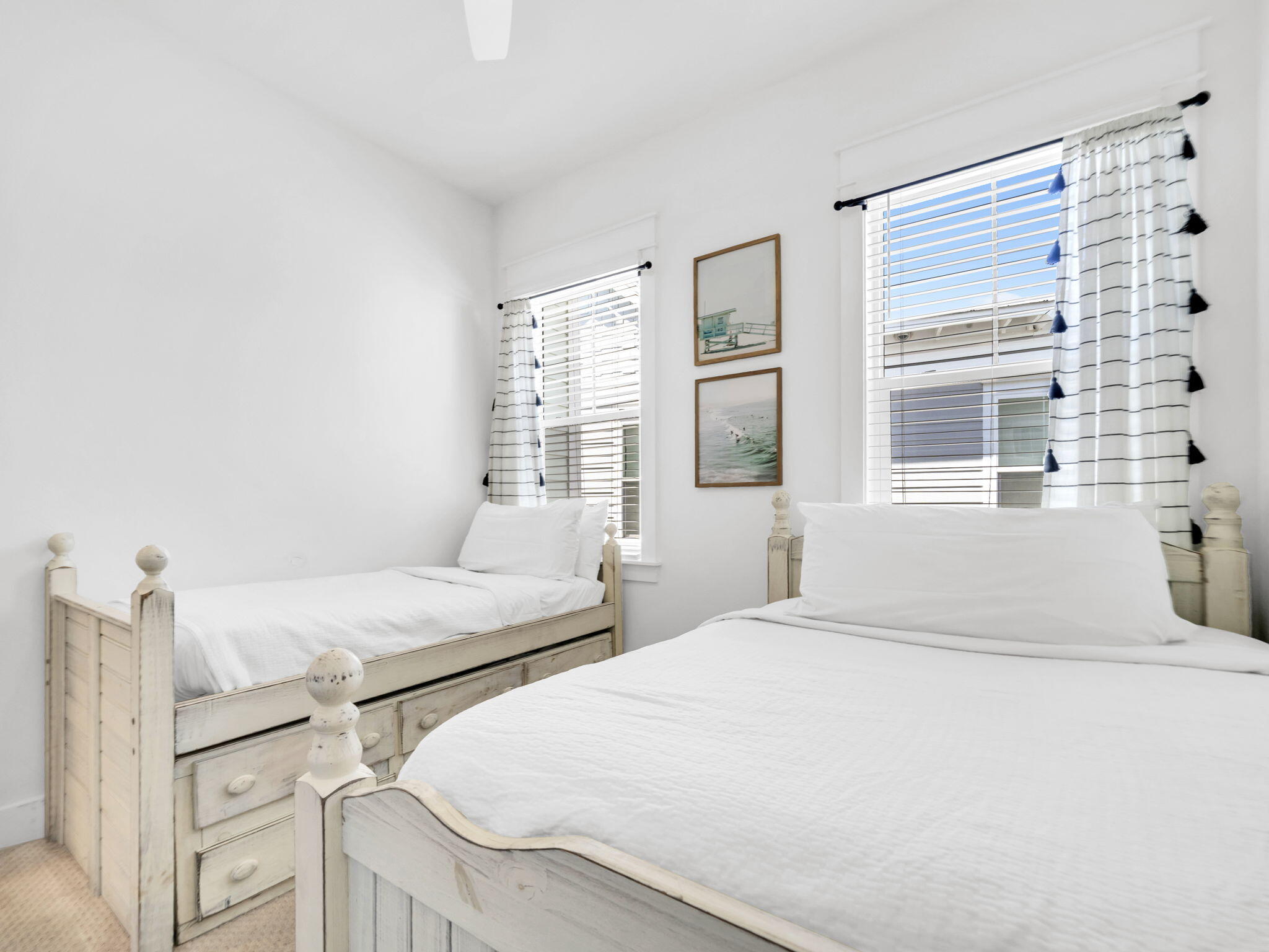 282 Milestone Dr Inlet Beach, Unit B Inlet Beach, FL 32461 - Photo 24 of 42 a bedroom with a bed and two windows