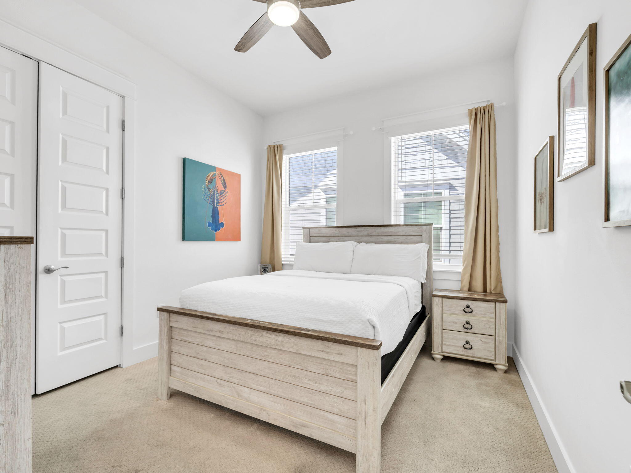 282 Milestone Dr Inlet Beach, Unit B Inlet Beach, FL 32461 - Photo 25 of 42 a bedroom with a bed and a painting on the wall