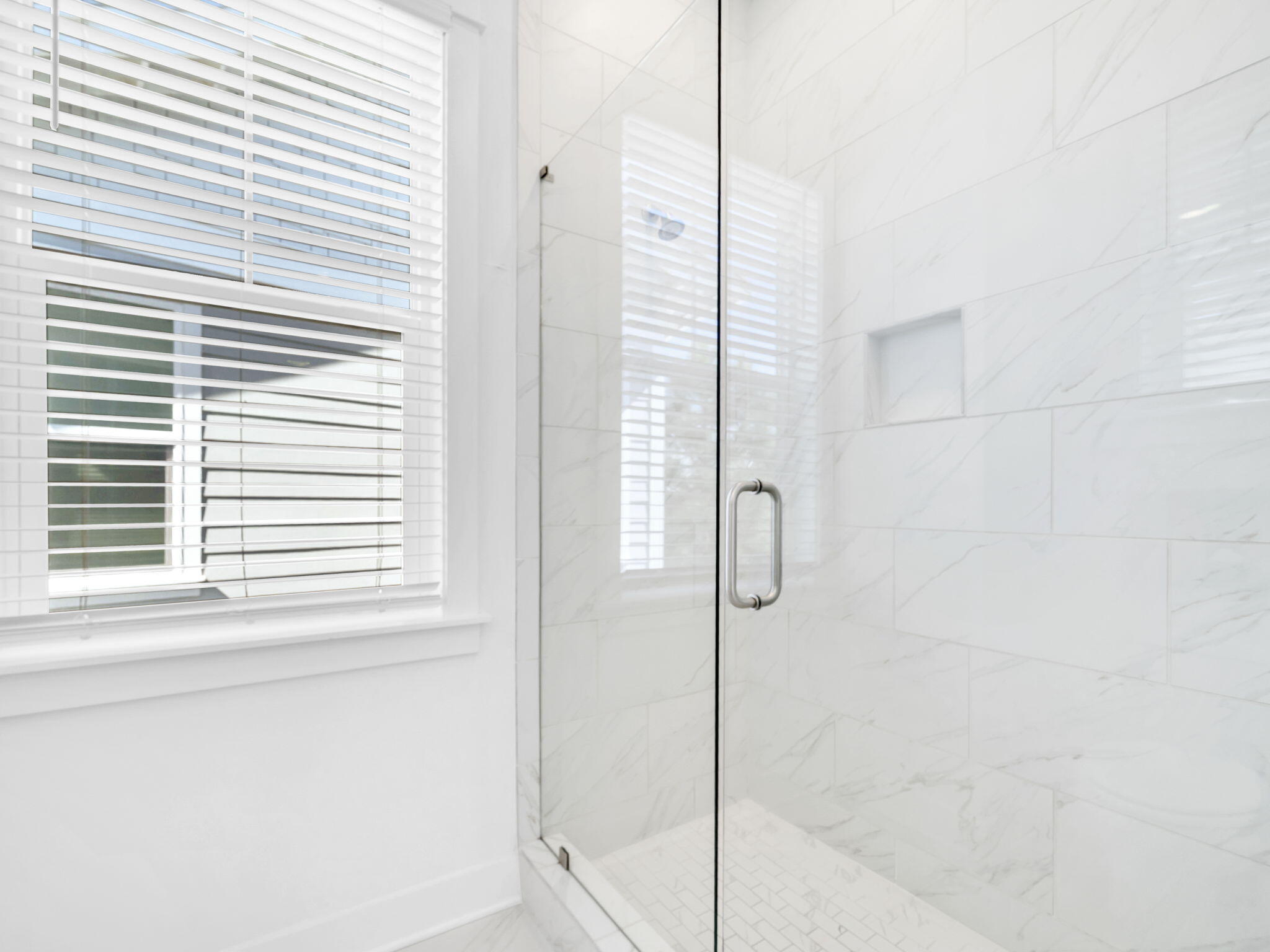 282 Milestone Dr Inlet Beach, Unit B Inlet Beach, FL 32461 - Photo 32 of 42 a bathroom with a glass shower door