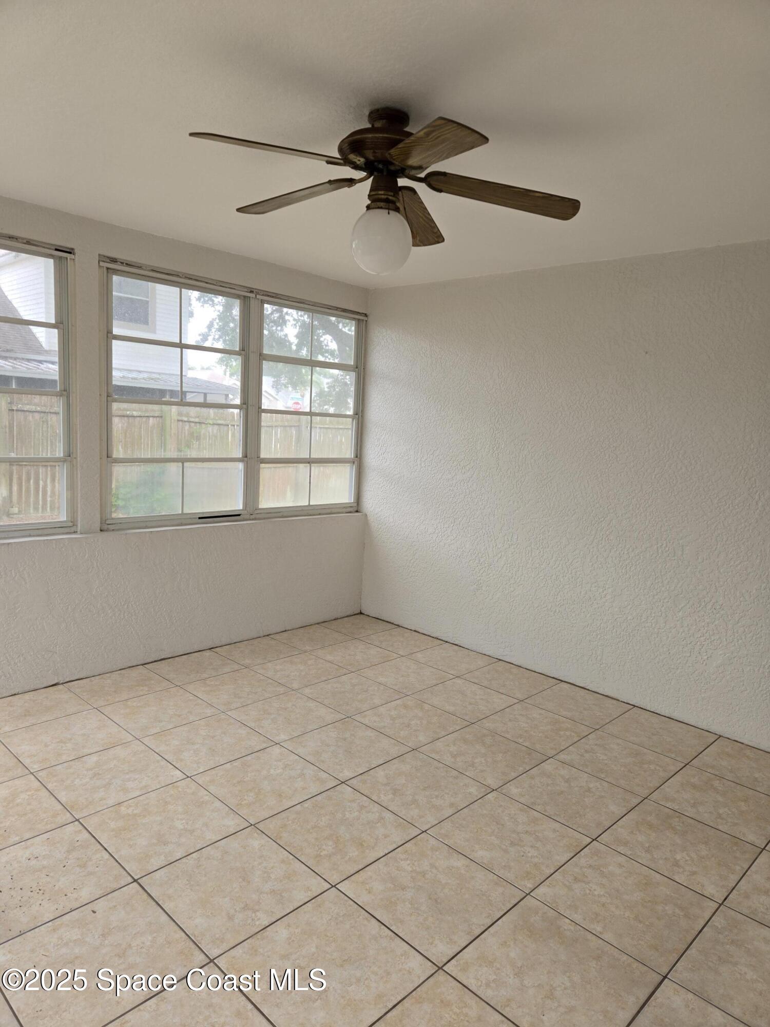 4533 Rivermist Drive Melbourne, FL 32935 - Photo 11 of 14 a view of an empty room with a window