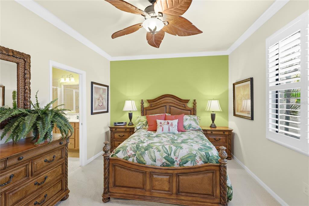 20209 Benissimo Drive Venice, FL 34293 - Photo 12 of 53 a bed room with a bed and a potted plant