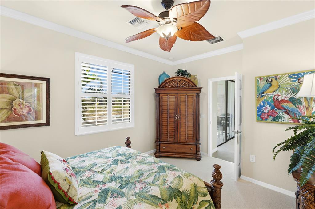 20209 Benissimo Drive Venice, FL 34293 - Photo 13 of 53 a bedroom with a bed and a painting on the wall