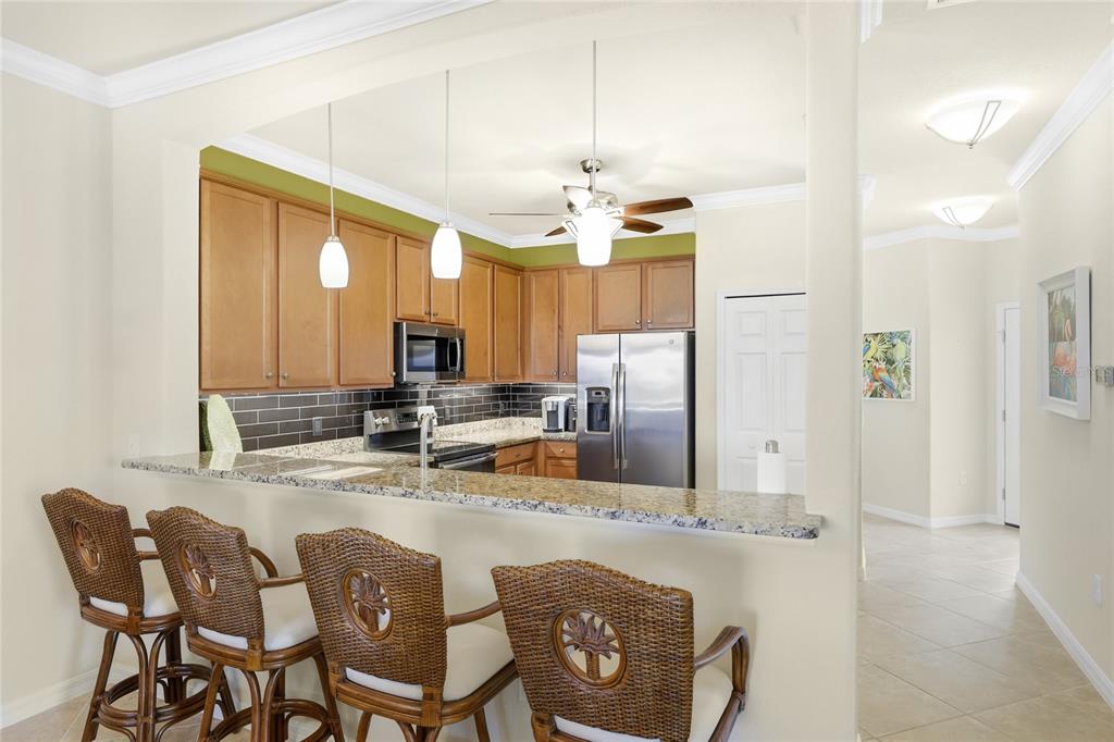 20209 Benissimo Drive Venice, FL 34293 - Photo 7 of 53 a dining table with chairs and chandelier