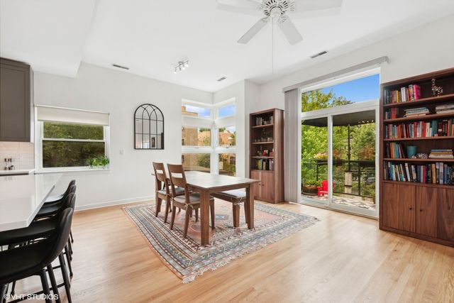 a view of a livingroom with furniture window and wooden floor