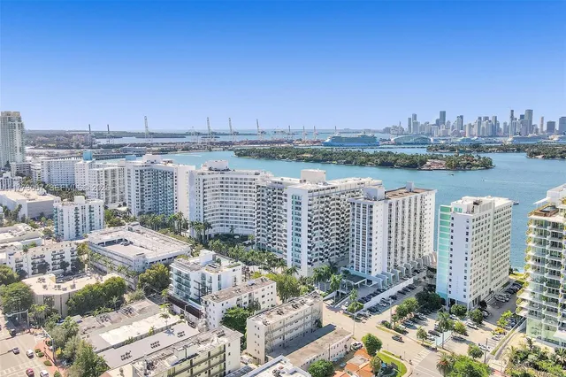 a view of a lake with a city skyline in the background