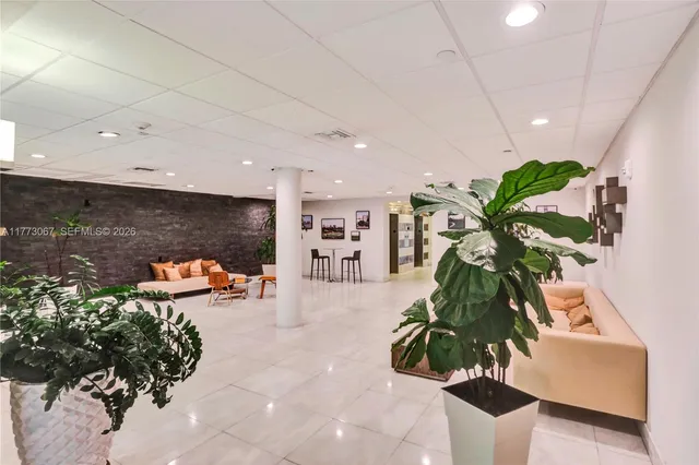 a view of entryway with flower plants