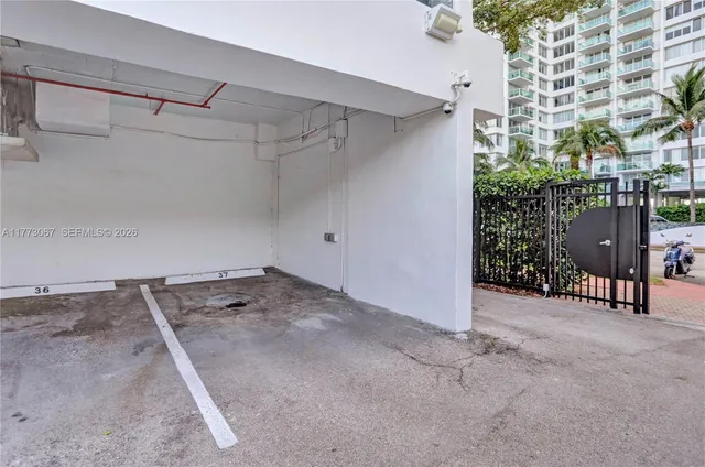 a kitchen with cabinets and chairs