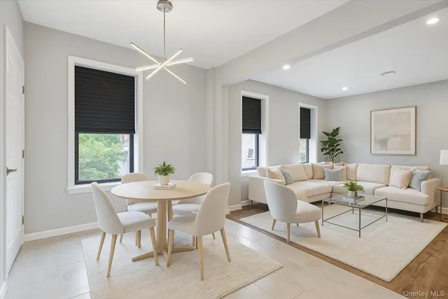 a view of a dining room with furniture window and outside view