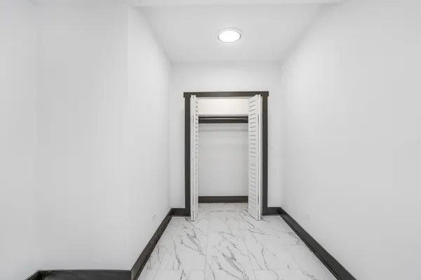 a view of hallway with closet