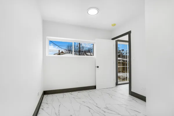 a view of a room with a hallway and closet