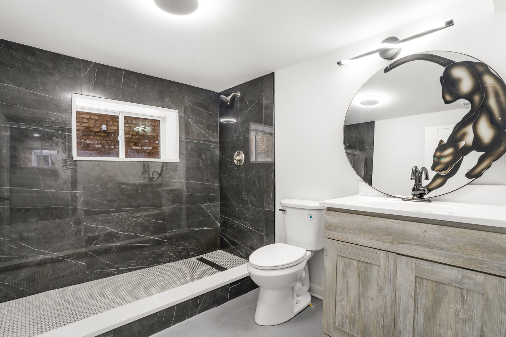 5526 South Albany Avenue Chicago, IL 60629 - Photo 21 of 25 a bathroom with a toilet a sink and mirror