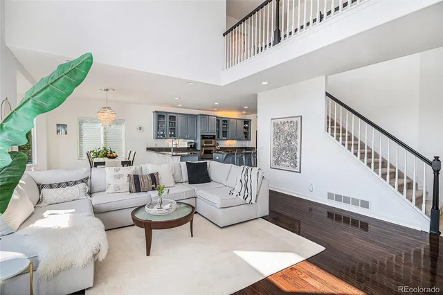 a living room with furniture fireplace and a rug