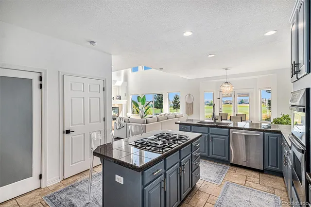 a kitchen with a stove and a sink