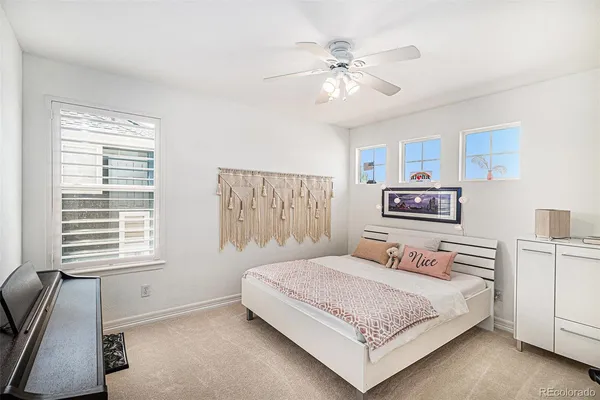a bedroom with a bed and a night stand